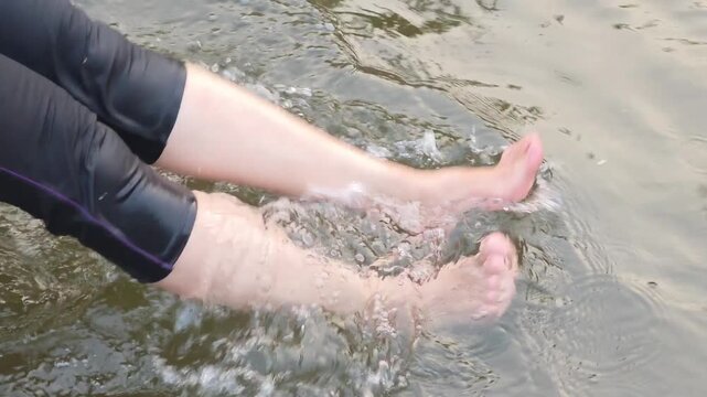 Exercise by swinging your legs in the water.
