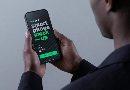  Cinematic Smartphone Mockup Held By Business Man With Gray Background
