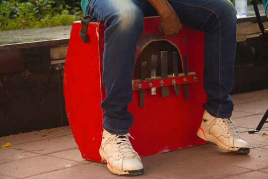 Marimba, a percussion instrument, but used as a kind of bass in merengue, a typical Dominican music