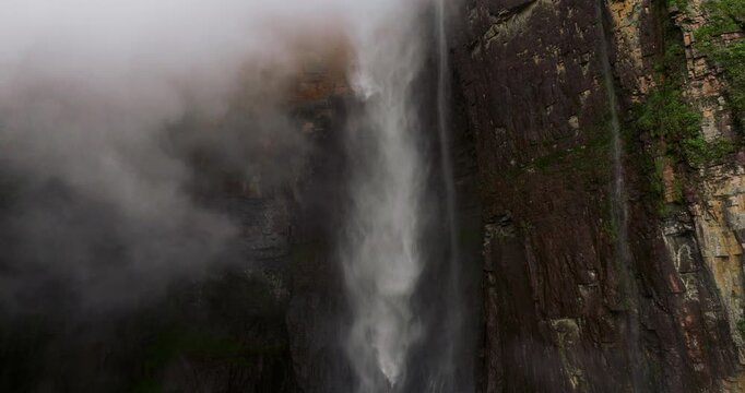 Angel Falls In Canaima National Park, Venezuela, Plunging With Mist And Clouds At Sunrise. close-up drone shot