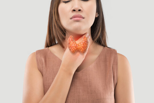 Woman touching her neck with a 3D thyroid highlighting thyroid cancer, hyperthyroidism, and related symptoms, isolated on a clean background