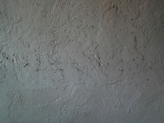 Fototapeta premium Close-up view of a textured, rough gray wall background