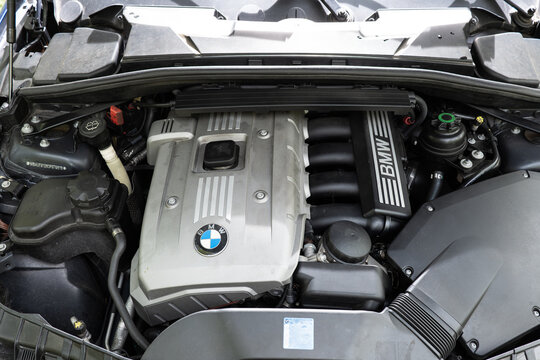 Zurich, Switzerland, April 17, 2026. Top view of a silver BMW N52B30 3.0 liter inline-six petrol engine bay in a blue metallic vehicle