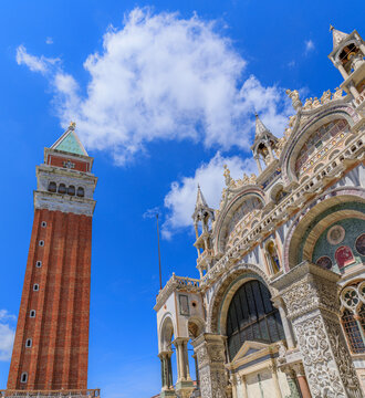 Saint Mark's Campanile and glimpse of Saint Mark's Basilica in Venice, Italy.
