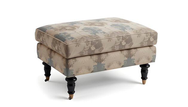 A stylish floral ottoman with black legs and gold feet on a white background