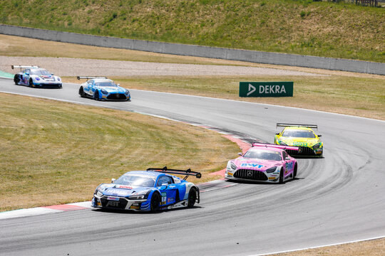 Oschersleben, Germany, May 28, 2023: Scenic view battle fast Mercedes BMW Audi Lamborghini Ferrari Porsche DTM at Oschersleben Motorsport Arena race track. European motors auto sport competition