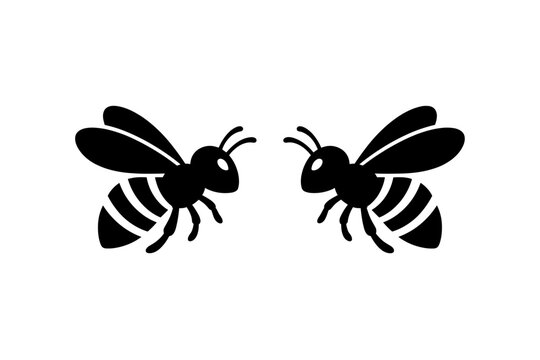 Two black bee silhouettes facing each other on a white background, simple flat vector illustration of honeybees or bumblebees for nature-themed logos, icons, and graphic design elements.
