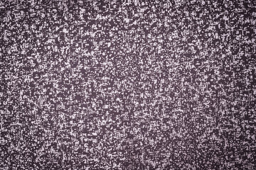 Fototapeta premium Simple fabric texture in shades of gray displayed on a flat surface during daylight