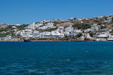 Fototapeta premium Panoramic View of White-Washed Mykonos Town Overlooking the Aegean Sea 