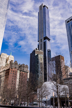 New York, United States - April 11, 2026: The slender residential skyscraper 125 Greenwich Street, designed by Rafael Vinoly, rises above Lower Manhattan near St. Nicholas Greek Orthodox Church.