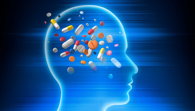 Blue silhouette of human head filled with colorful pills on blue luminous background