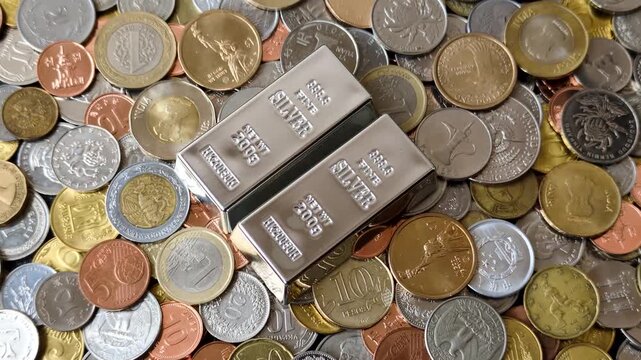 A silver bar, white metal against a backdrop of money, as a concept for the sales market. A silver bar as a background for your design