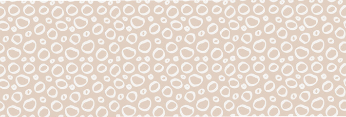 Seamless cute pattern with small irregular polka dots in neutral pastel tones. Minimal Scandinavian boho style on light background. Perfect for nursery, kids fabric, wallpaper, wrapping paper, print. © Viktoriia