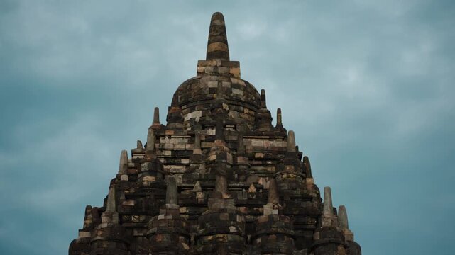 Cinematic footage of the historic Prambanan Temple in Indonesia. Majestic stone structures, intricate carvings, and ancient architecture create a powerful cultural and spiritual atmospher