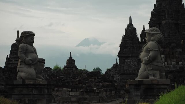 Cinematic footage of the historic Prambanan Temple in Indonesia. Majestic stone structures, intricate carvings, and ancient architecture create a powerful cultural and spiritual atmospher