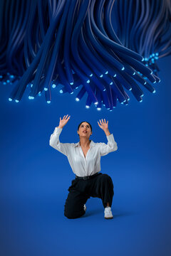 3D fiber canopy crouching woman beneath glowing cable