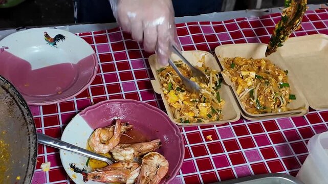 Serving Fresh Pad Thai Into Takeaway Boxes Thai Street Food Close-Up 4K