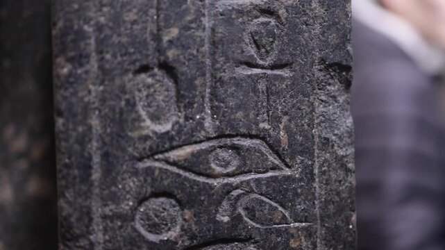 Ancient egyptian hieroglyphs with the eye of horus carved on a stone stele representing pharaoh art, culture, and civilization from the historic temple of karnak