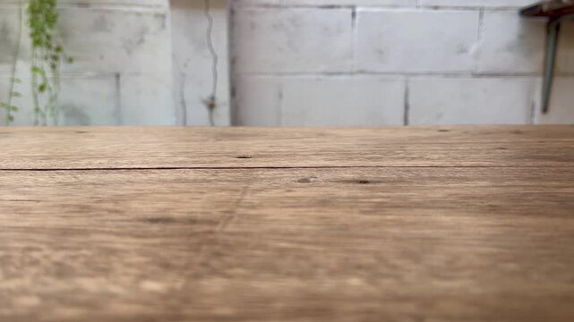 Wooden table and brick wall