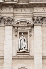 Obraz premium Statue of St. Francesco Saverio on the Facade of the Chiesa del Gesù Church in Rome, Italy