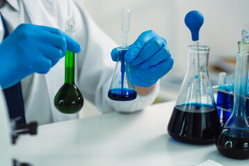 Fototapeta premium Scientists are working with microscopes and test tubes in laboratories, conducting scientific research and development in medical technology. This is the concept of laboratory research and development