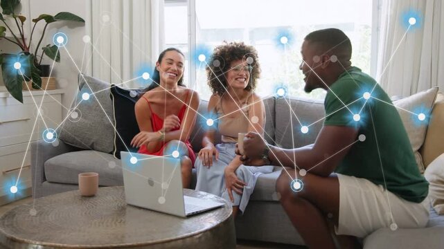 Three adults talking, man leaning forward sparking blue nodes graph over laptop showing tech data