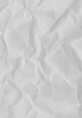 Obraz premium Crinkled Paper Texture: Abstract close-up of a rumpled sheet of paper, a testament to the tactile beauty of everyday materials and the subtle interplay of light and shadow.