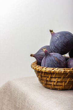 Fresh figs in a straw basket.