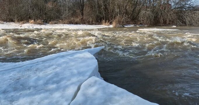 Spring snowmelt (also known as freshet) at Ruutinkoski rapids in spring, Helsinki, Finland, Europe.