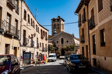 Fototapeta premium The city center of the fortified city of Segovia that is located in central Spain. The city has a large aqueduct near the city center.
