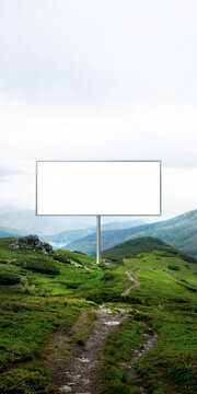 Outdoor billboard mockup on mountain trail with leading path composition. Concept of advertising layout, copy space usage, brand storytelling and campaign presentation.