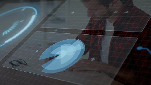 Tech pro leaning over clear surface, tapping stylus and rotating blue hologram UI for design