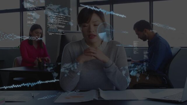 Lead woman sorting pages leaning forward causing map waves code drifting over business sharing data