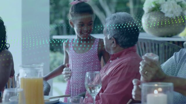 Girl coming to senior, saying hello at family meal, nan shaking salt, dotted wave sweeping faces