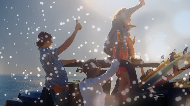 Woman on rack raising bottle, five adults steadying and raising bottles near surfboards toasting