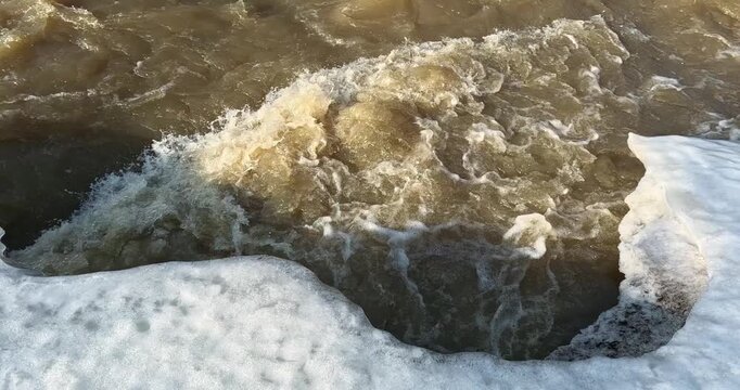Spring snowmelt (also known as freshet) at Ruutinkoski rapids in spring, Helsinki, Finland, Europe.