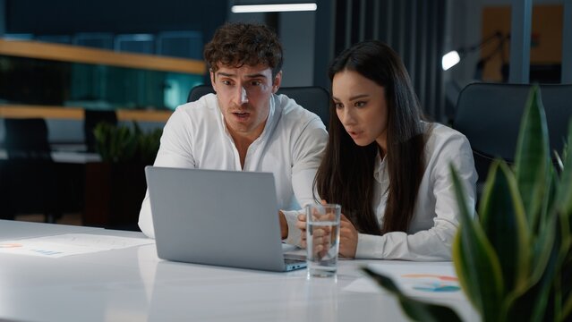 Two Caucasian colleagues losing with laptop upset failure partners business coworkers lost fail with computer feeling frustration businessman with businesswoman disappointed with online failed work