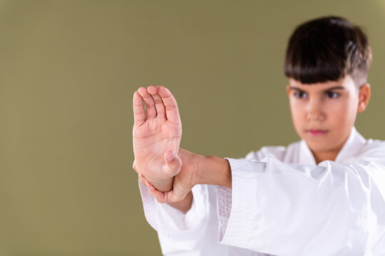 Demonstrating a basic karate blocking technique with proper hand positioning. Emphasis on control, coordination, and martial arts fundamentals.