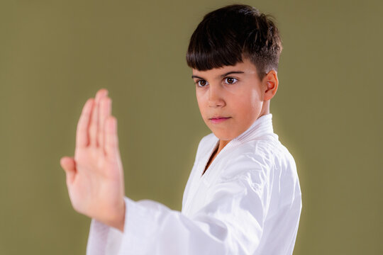 Shuto uke in a strong stance, showing balance and controlled movement in Shotokan karate training.
