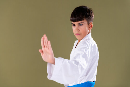 Close up view of a karate student performing shuto uke, highlighting hand position, alignment, and proper Shotokan technique execution.