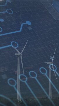 Vertical video: Overlay sweeping from upper-left while two turbines rotating, mapping power flow