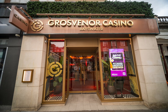 LONDON -  Grosvenor Casino Bayswater entrance with modern bronze facade on Queensway
