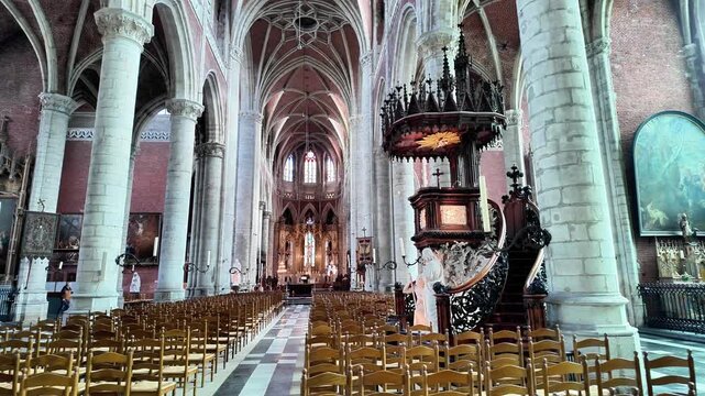 Detailed view of a monumental carved wooden pulpit in a Ghent church.