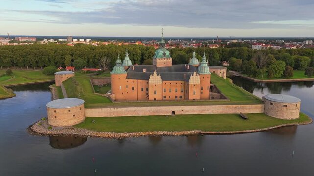 The Renaissance era Kalmar Castle is located in the city of Kalmar, Sweden. Water surrounds the fortified walls and turrets of Kalmar Castle in Sweden. 4K aerial shot