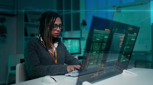 Young woman IT engineer writing code on sleek futuristic screen in modern office