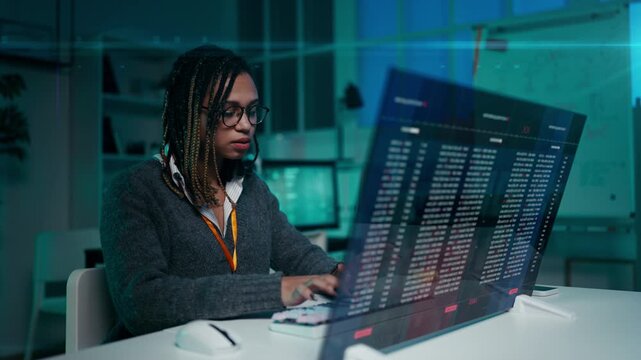 African American woman developer coding efficiently on futuristic interface