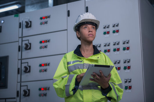 engineer working on the checking status switchgear electrical energy distribution substation	