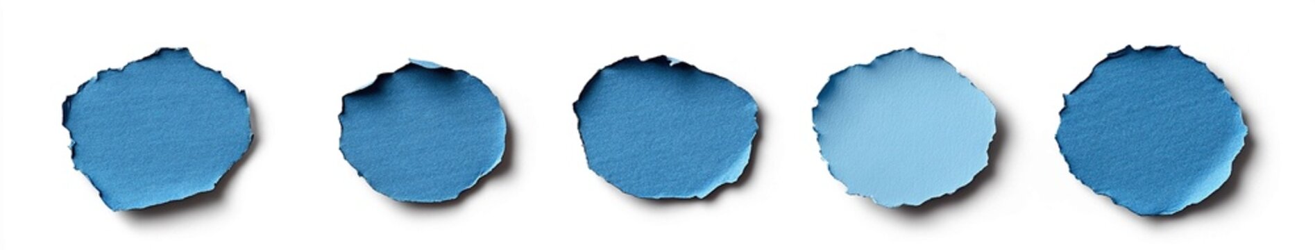 A set of five blue circular stickers, each with different shapes and textures, isolated on a white background.
