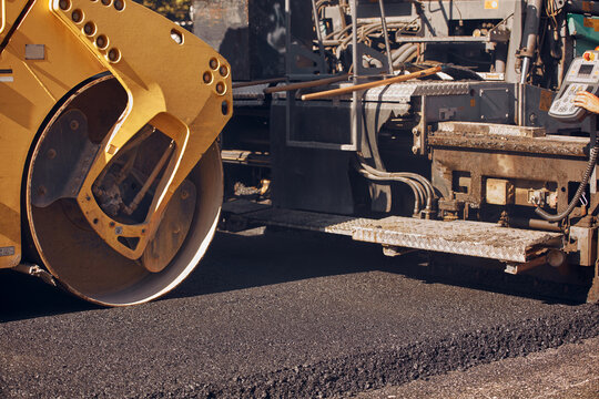 Public city street reconstruction with heavy machines.