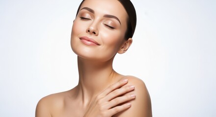 Naklejka premium Calm woman with bare shoulders and closed eyes enjoying soft light on her smooth skin, representing relaxation, natural beauty, gentle skincare, and peaceful wellness
